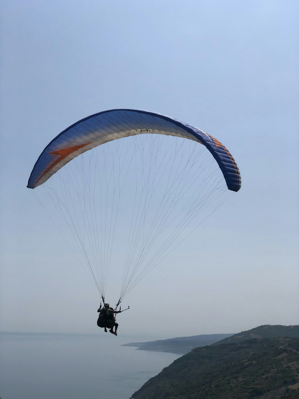 person in parachute during daytime