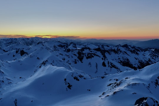 snow covered mountains during sunset in Pyrénées-Orientales France