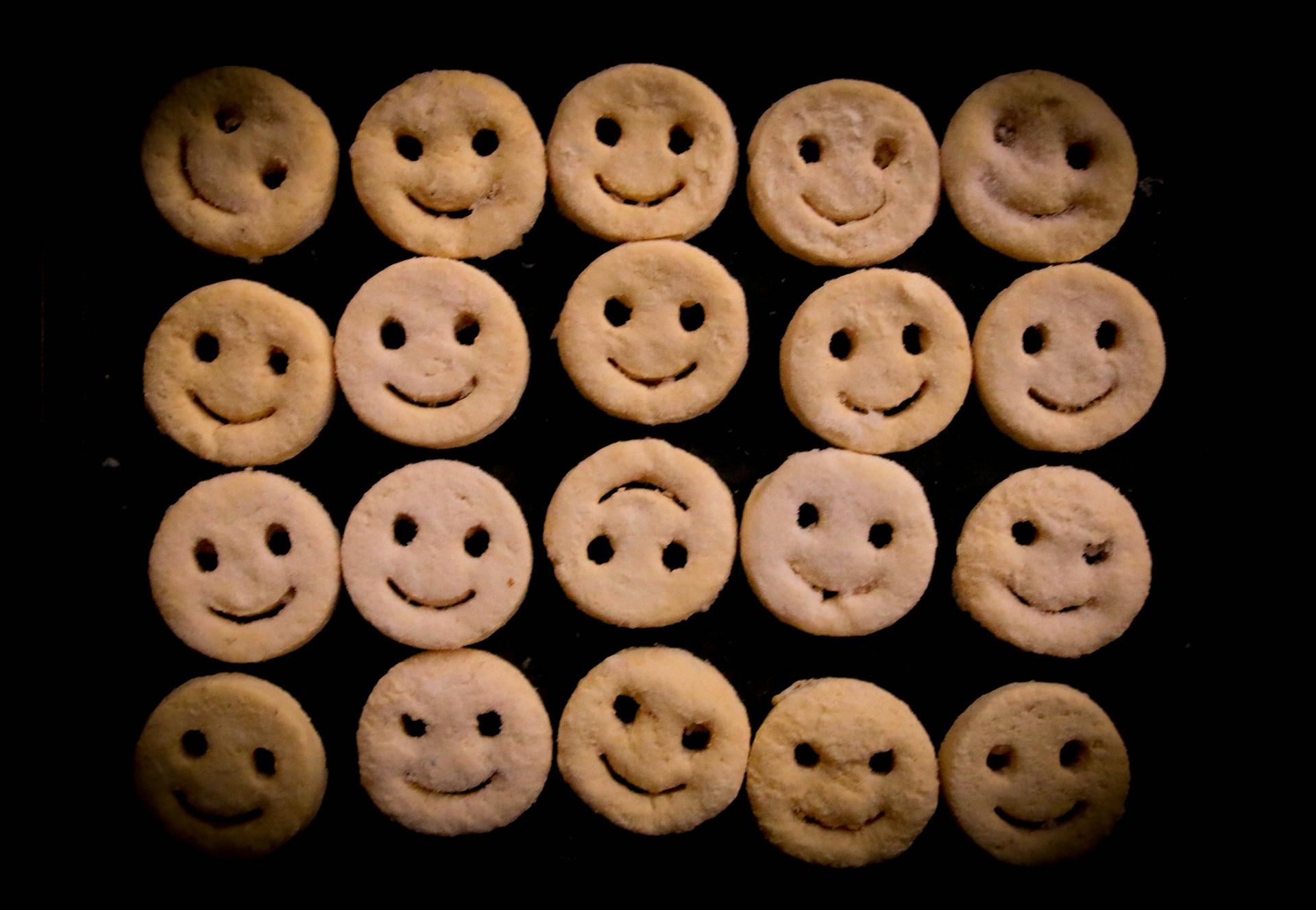 white round cookies on black surface