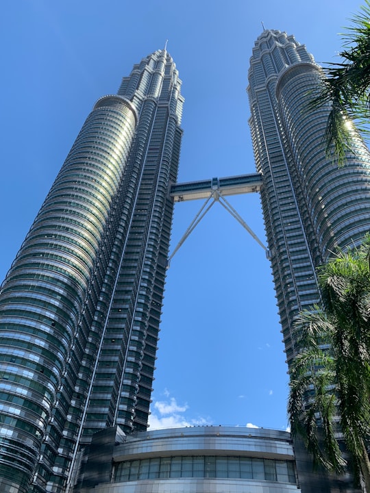 low angle photography of gray high rise building in Menara Kuala Lumpur Malaysia