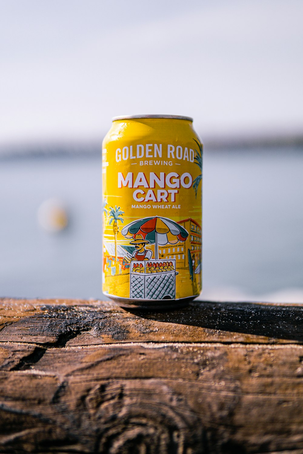 yellow and white can on brown wooden table