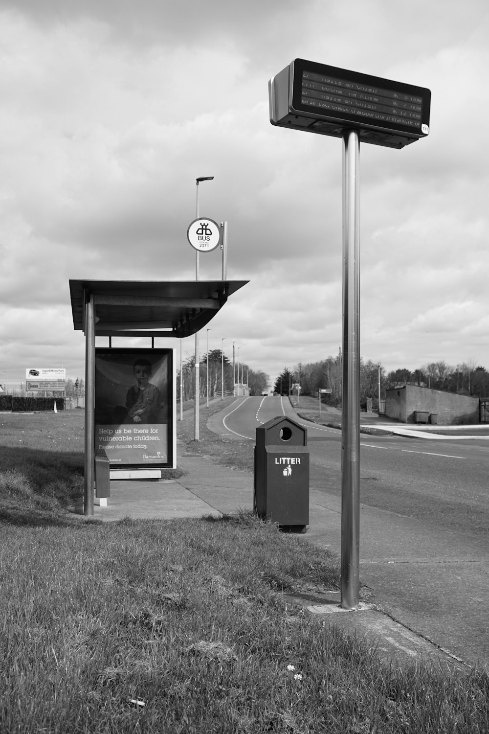 grayscale photo of stop sign