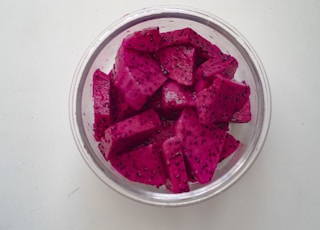 sliced watermelon in clear glass bowl