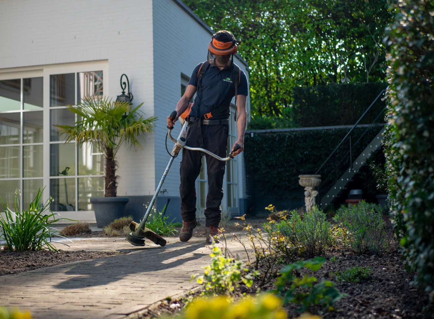Pest control technician preparing residential treatment equipment