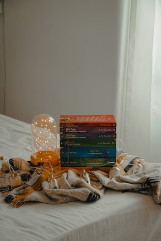A neat stack of colorful storage boxes arranged in a cozy living room corner.