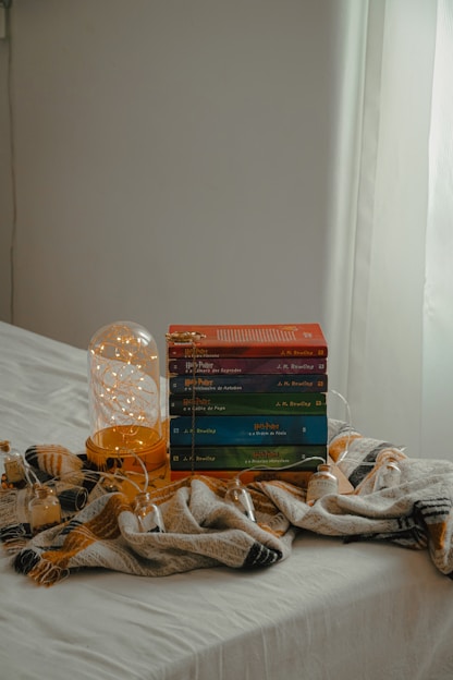 A neat stack of colorful storage boxes arranged in a cozy living room corner.