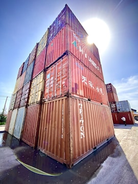 Modern warehouse with containers ready for export under warm sunlight.