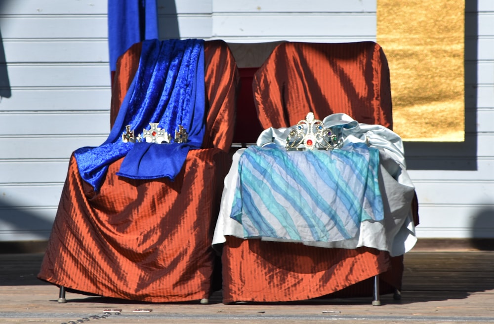 blue and orange textiles on brown wooden table