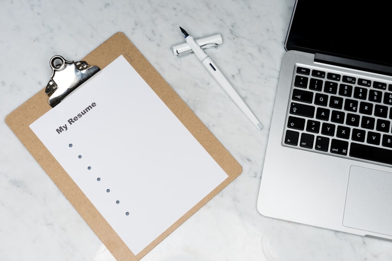 Desk with printed documents and a pen ready for review