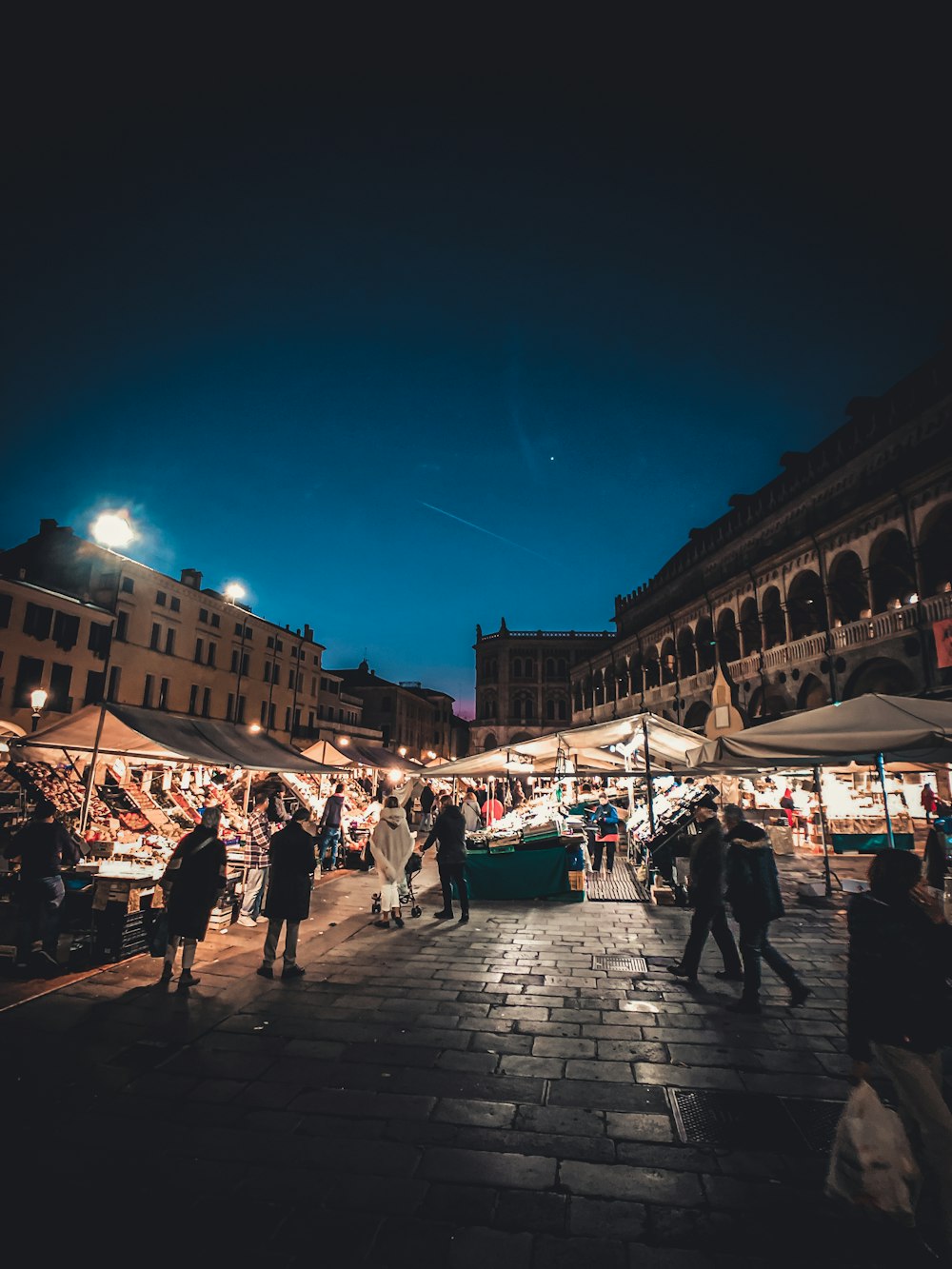 people walking on street during night time