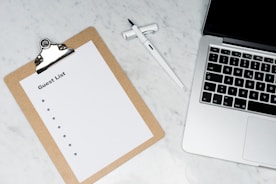 white paper on silver laptop computer