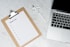 white paper on silver laptop computer