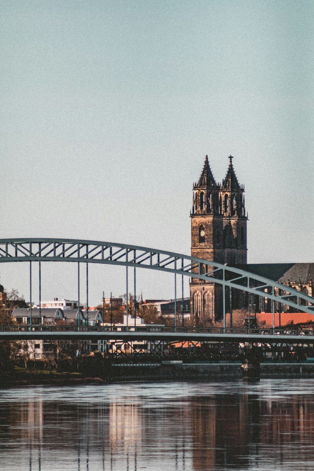 brown and gray bridge under gray sky