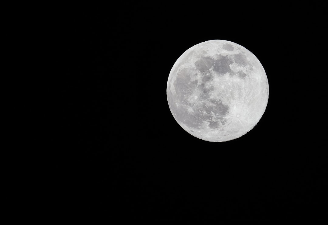 full moon in dark night sky