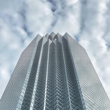 gray concrete building under cloudy sky during daytime