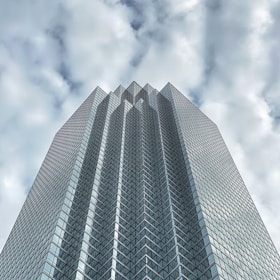gray concrete building under cloudy sky during daytime