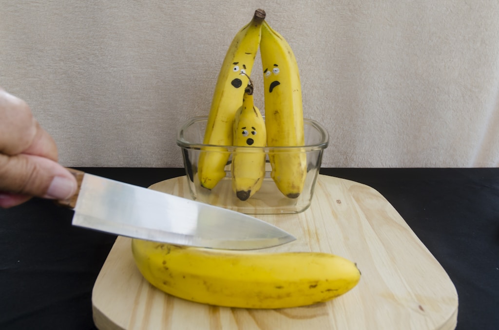 yellow banana fruit on clear glass bowl