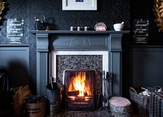 black fireplace with brown wooden frame