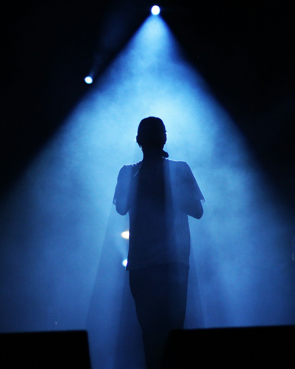 silhouette of man holding camera