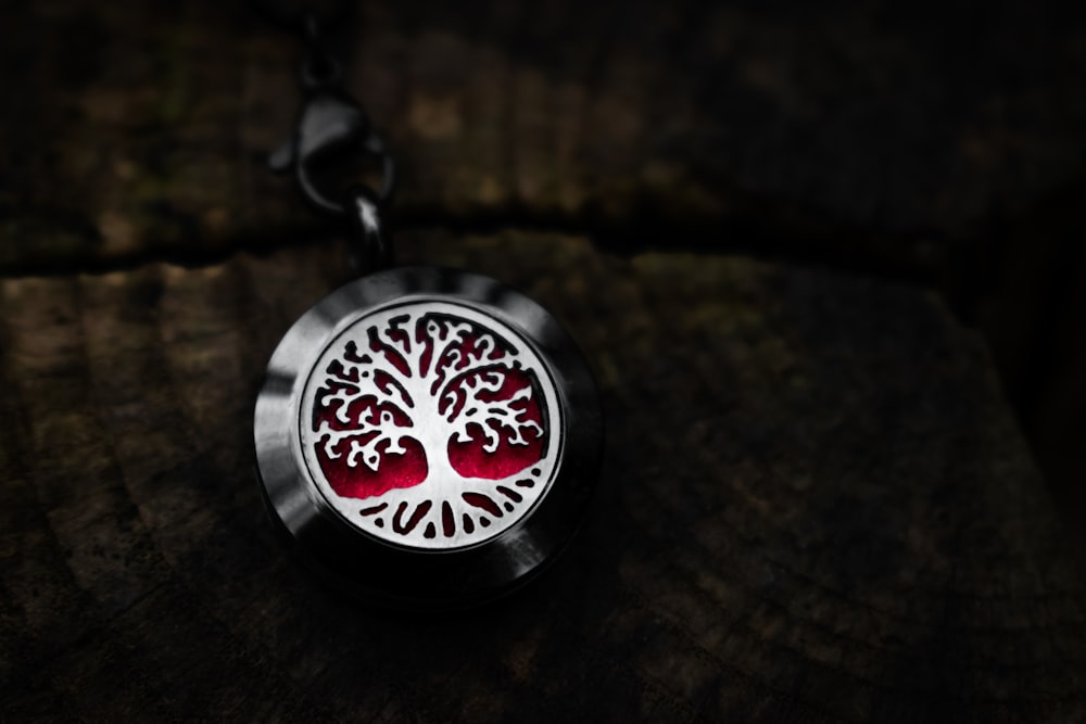 black and silver round pendant