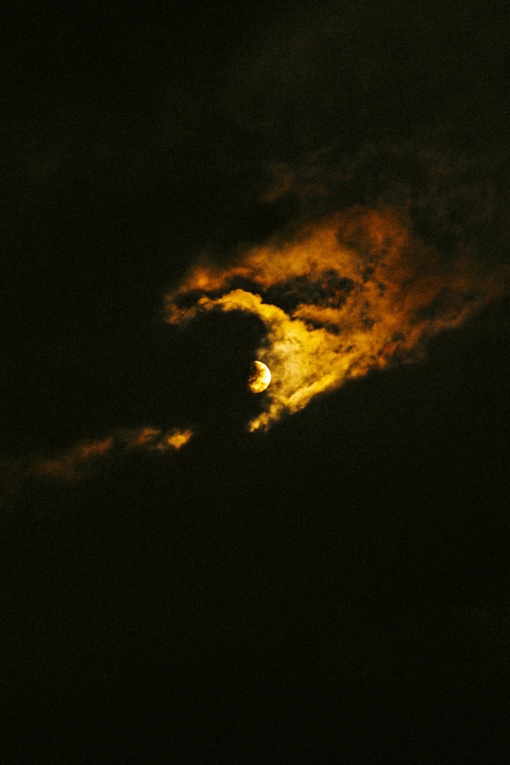black and orange clouds during night time