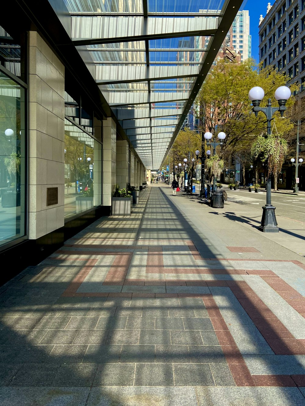 people walking on sidewalk near building during daytime