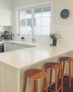 brown wooden chair beside white wooden table