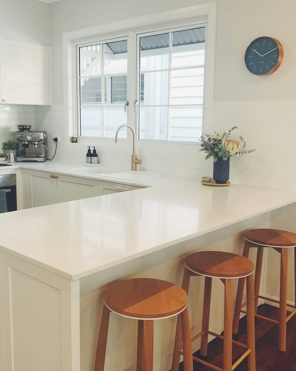 brown wooden chair beside white wooden table