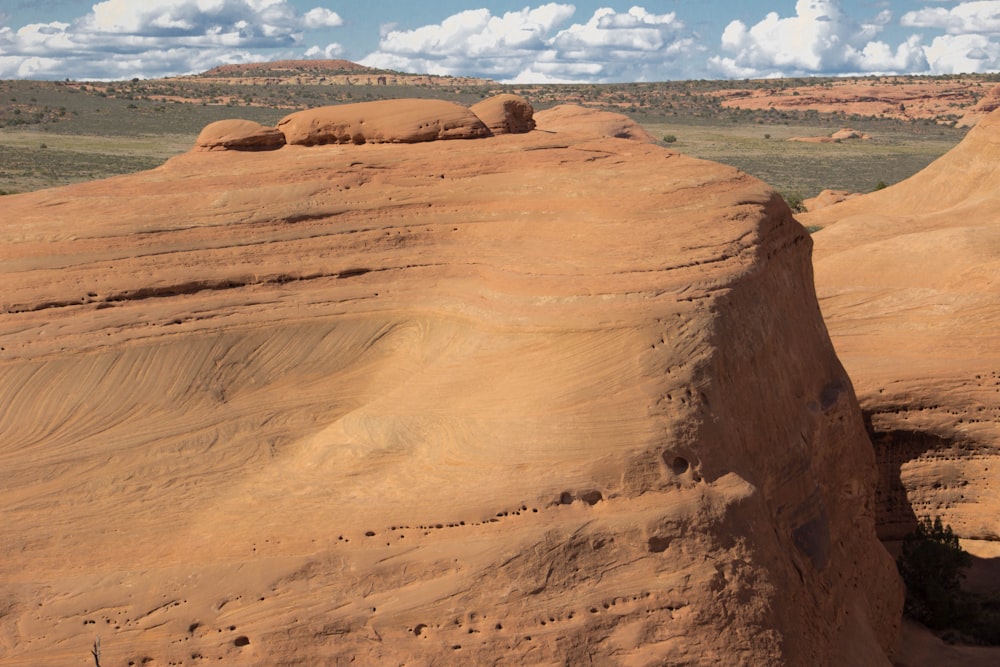 brown rock formation under blue sky during daytime