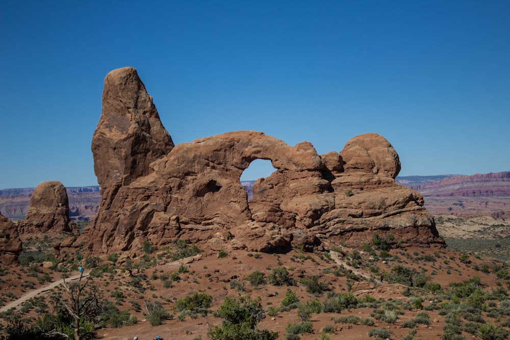 brown rock formation under blue sky during daytime