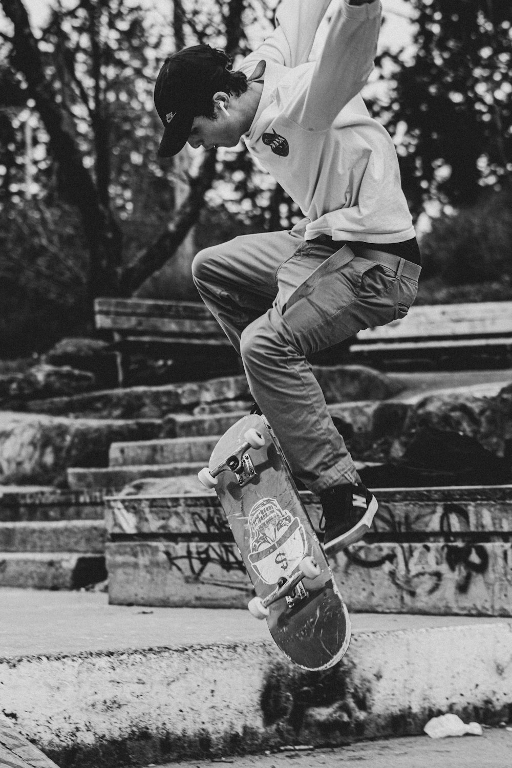 man in white hoodie and pants playing skateboard