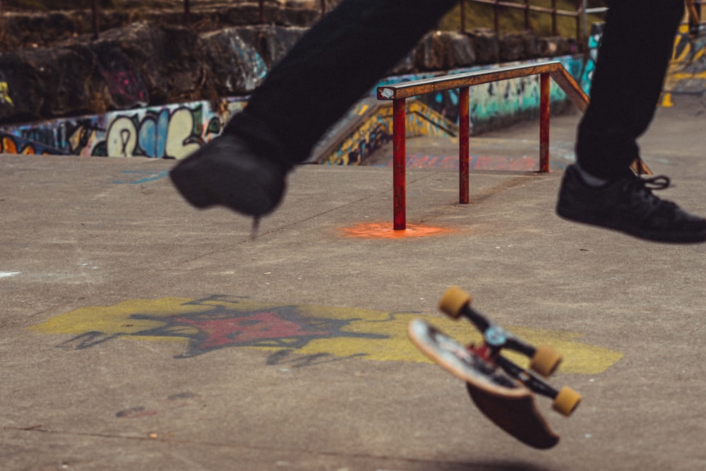 person in black pants riding skateboard during daytime