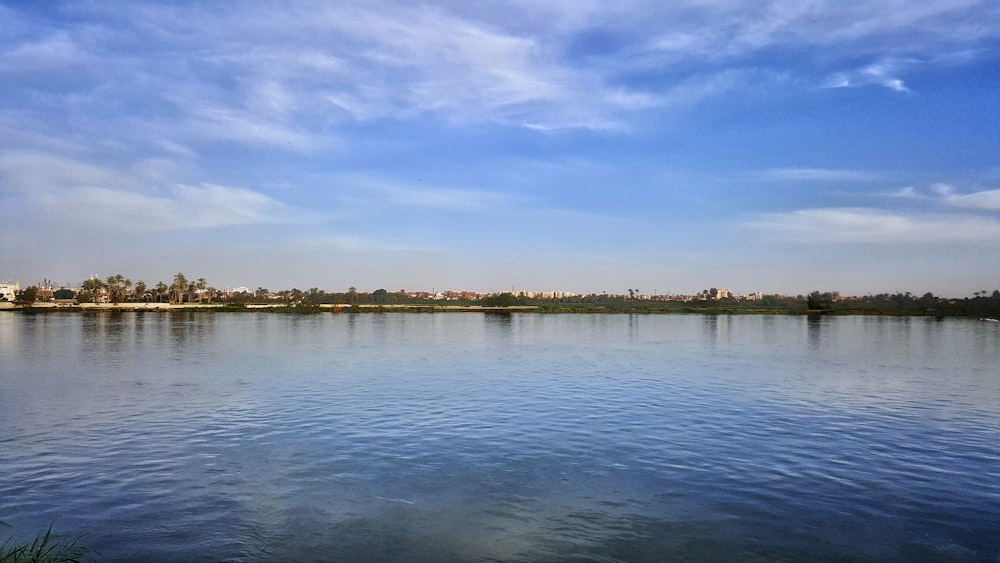 body of water under blue sky during daytime