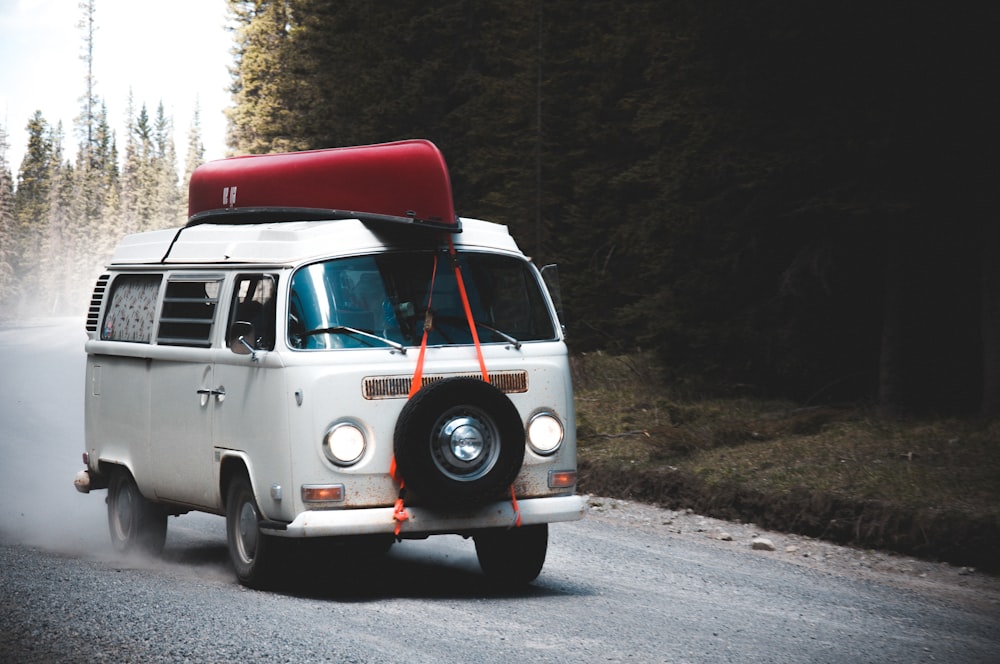 red and white volkswagen t-2 van on road during daytime