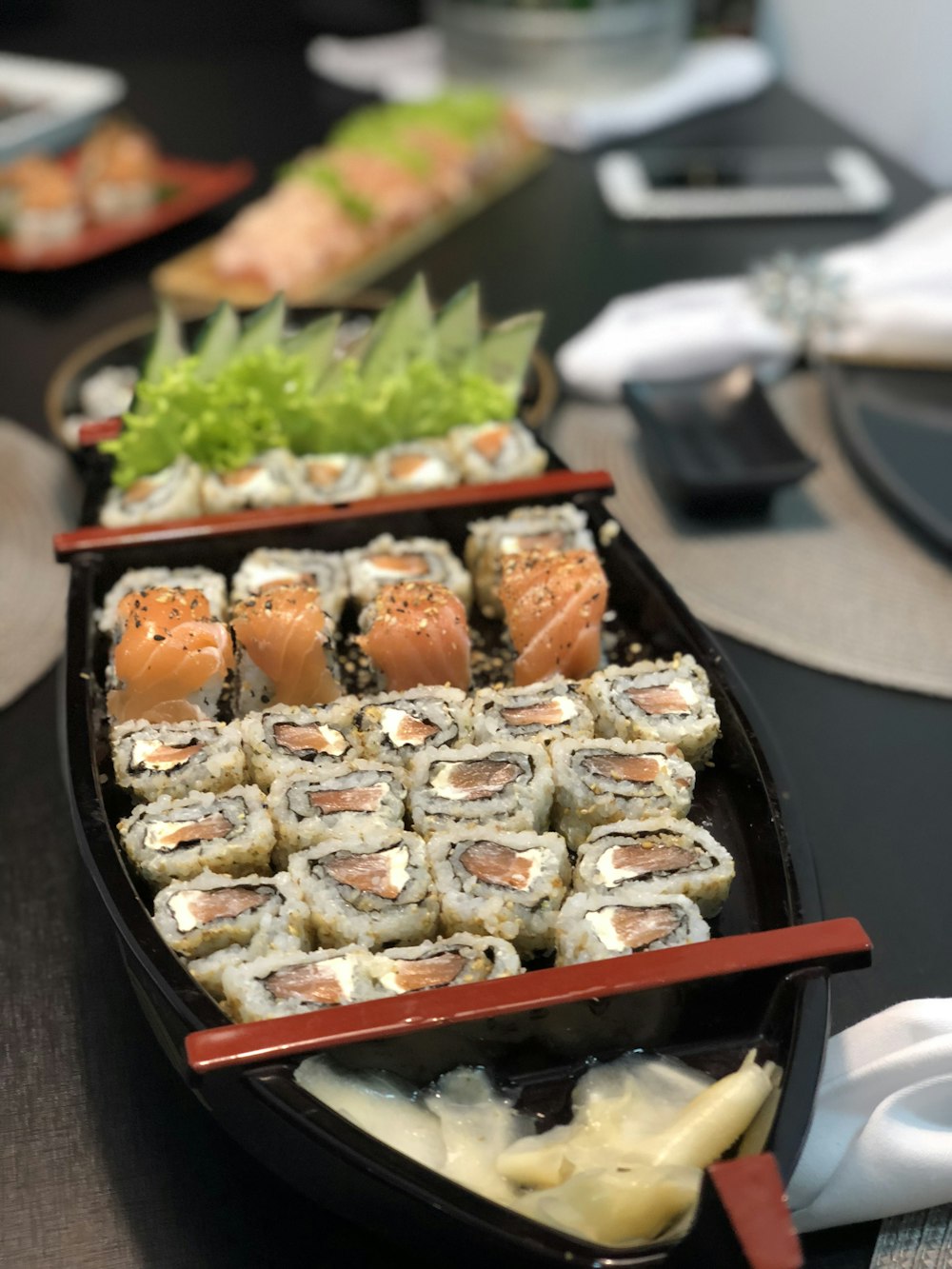 cooked food on black and red tray