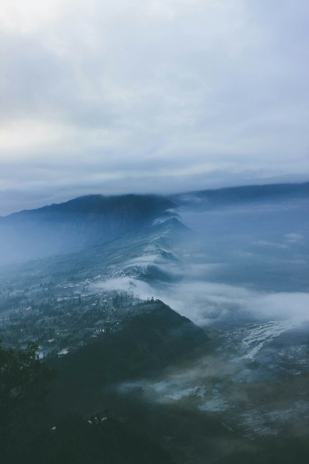 black mountain covered by clouds