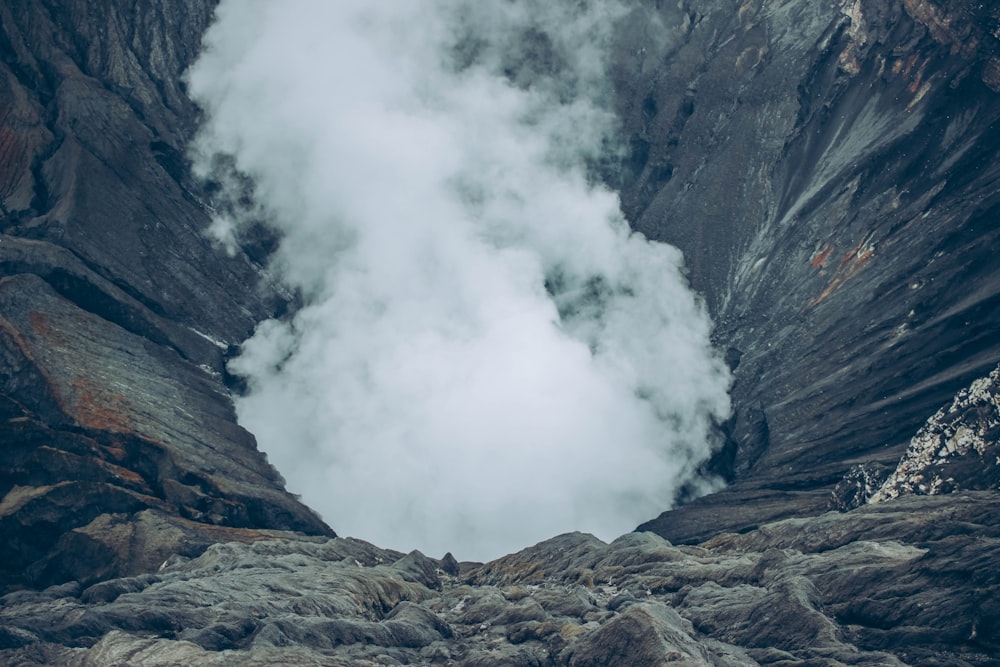 gray rocky mountain with white clouds