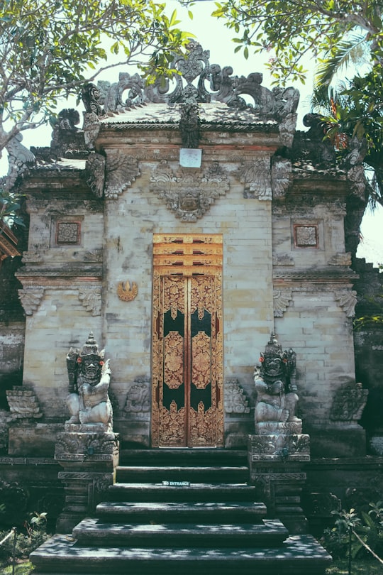 brown and black concrete building in Ubud Palace Indonesia
