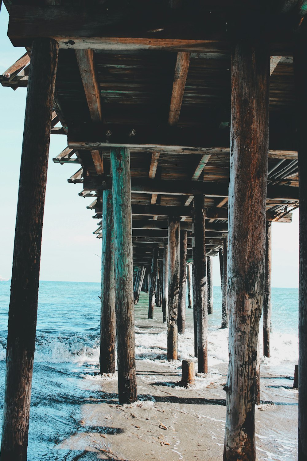 brown wooden dock on sea during daytime