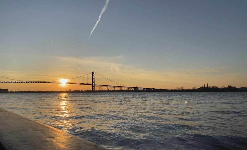 bridge over water during sunset