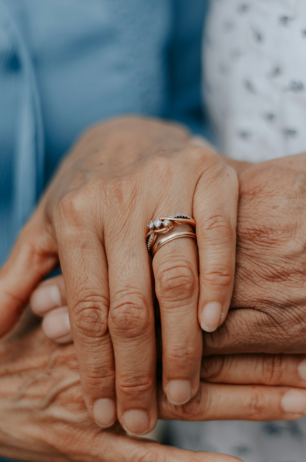 person wearing gold wedding band