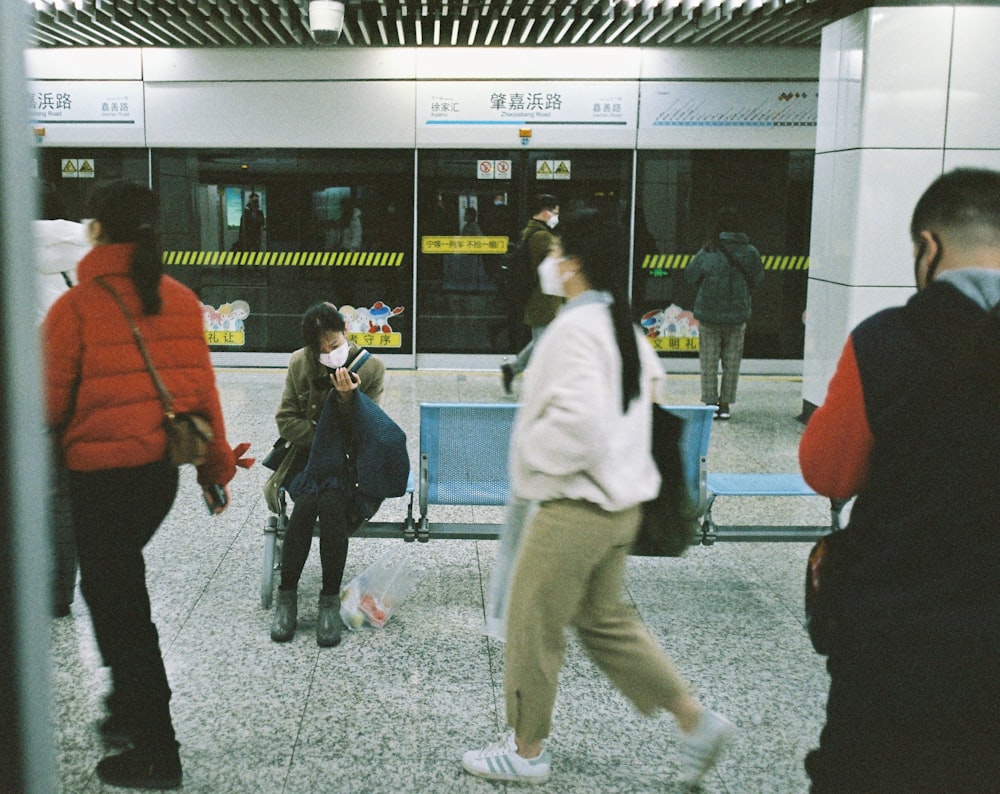 people walking on gray concrete pavement during daytime