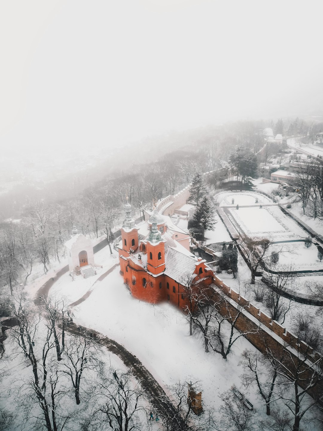 brown and white house covered with snow during daytime