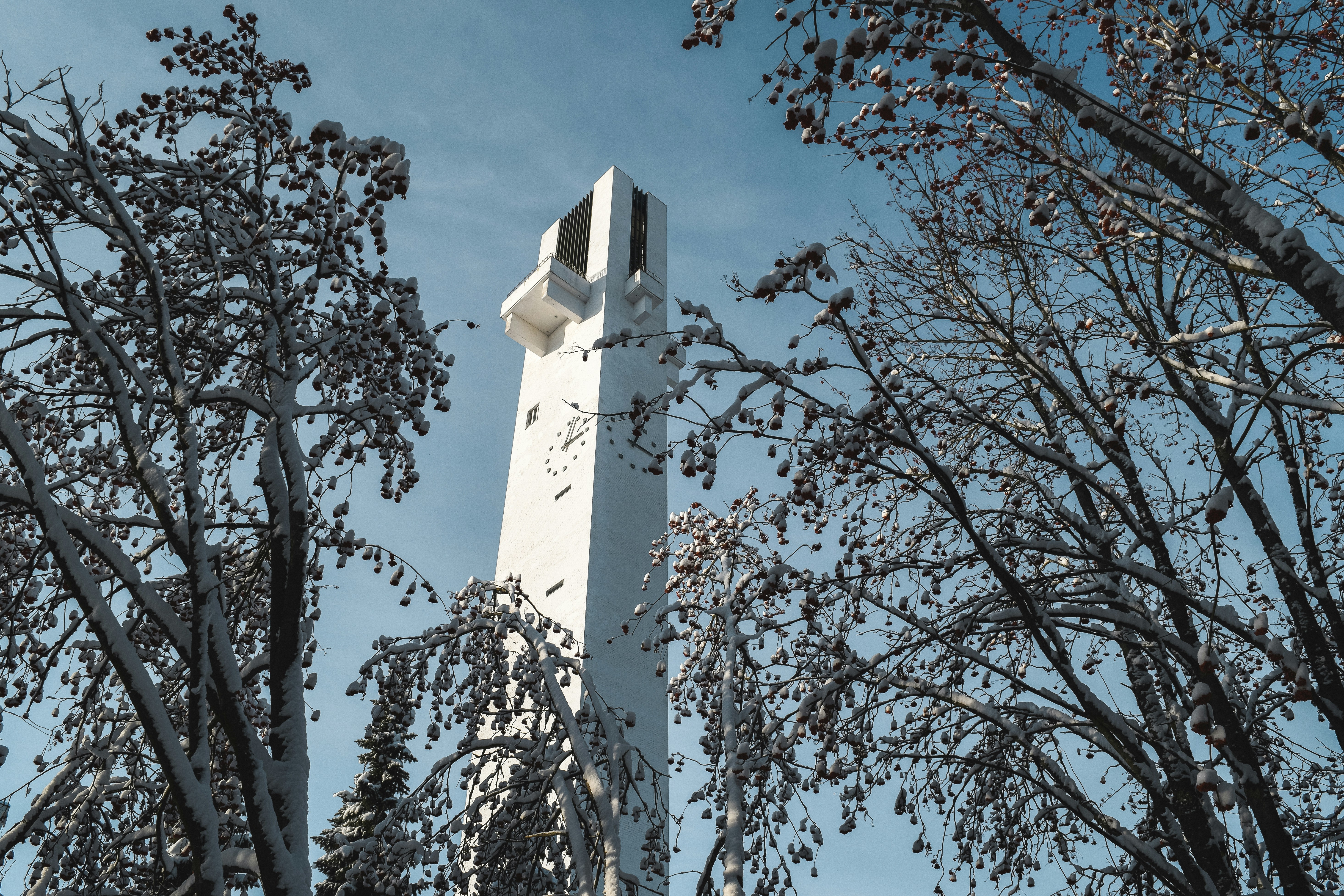 white concrete tower under blue sky during daytime