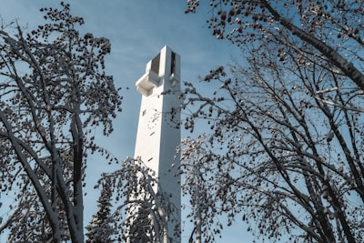 white concrete tower under blue sky during daytime
