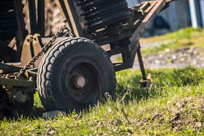 brown wooden trailer on green grass field during daytime wheel google meet background