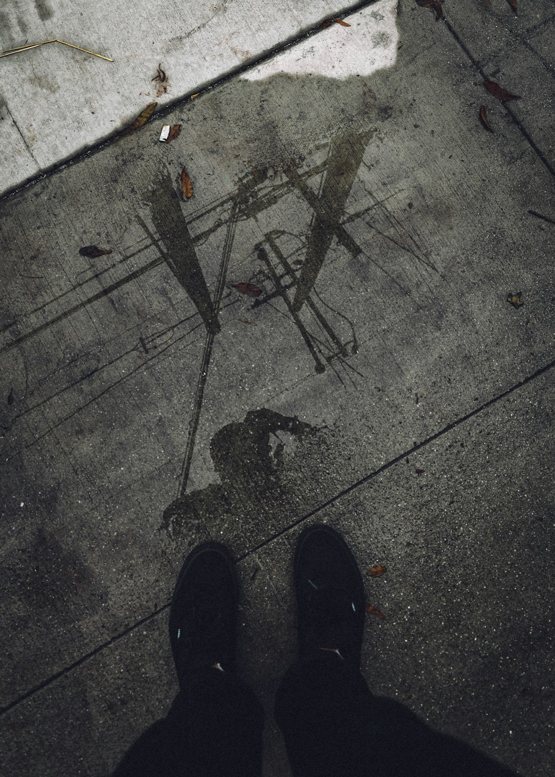 shadow of person on gray concrete floor