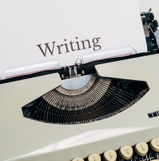 black and white typewriter on white table