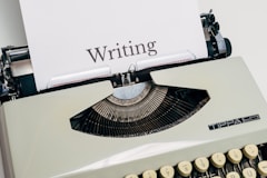 black and white typewriter on white table