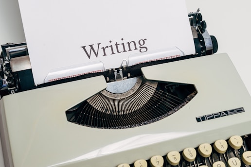 black and white typewriter on white table